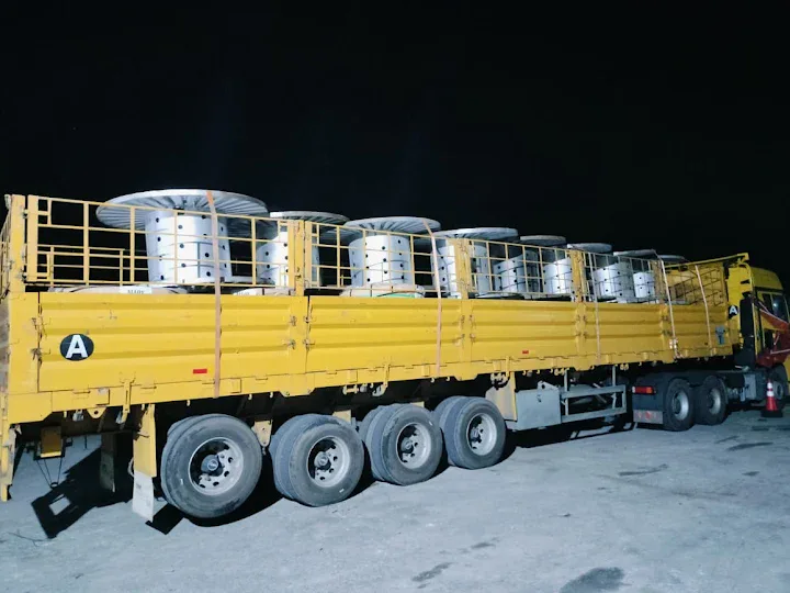 Industrial cable drums carried by open truck
