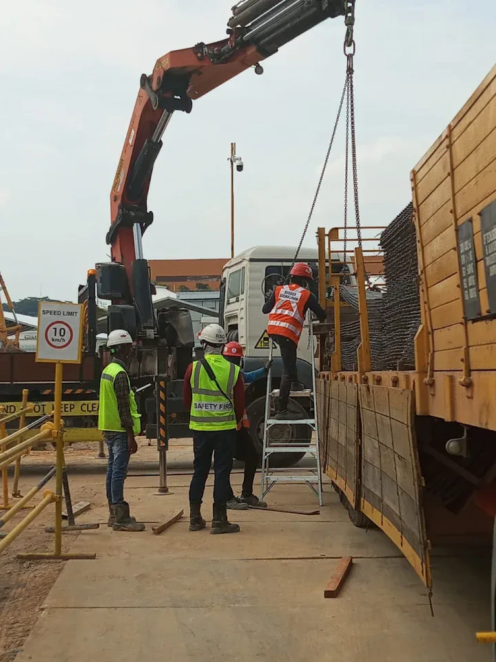 Crane-assisted loading at an industrial site