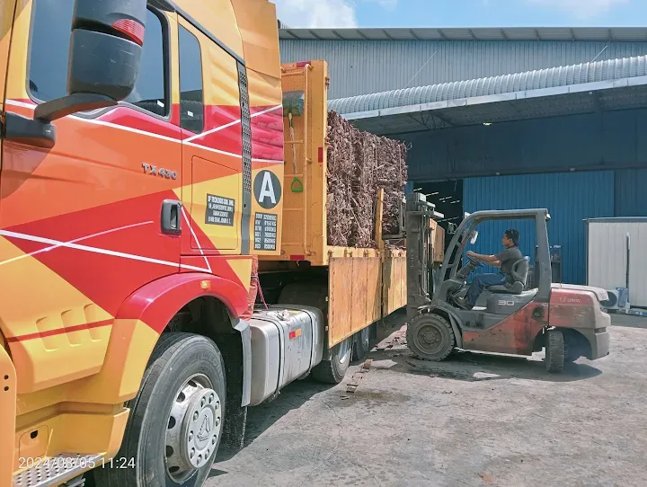 Forklift loading cargo onto an SF Lorry vehicle
