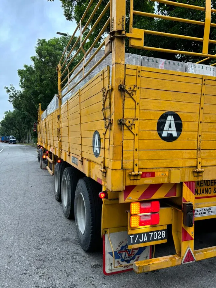 High-fence lorry carrying commercial cargo