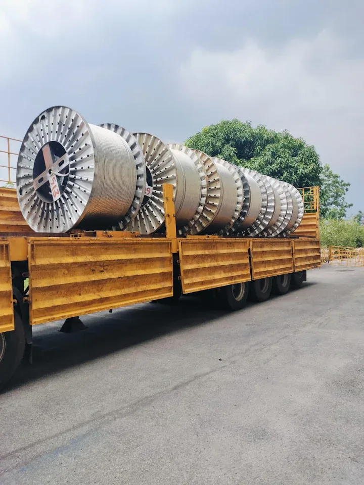 Large industrial cable reels on an open truck